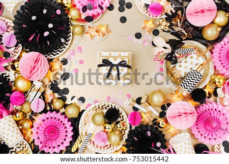 Gift with Party decoration background. Gold, black and pink color. Flat lay, top view
