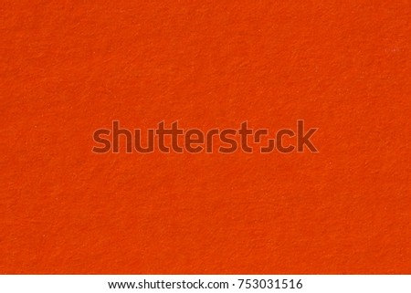 Background of orange paper texture, macro shot. High resolution photo.
