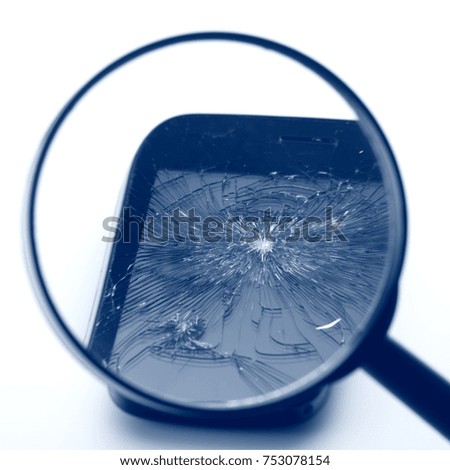 Smartphone and magnifier on white background Selected focus