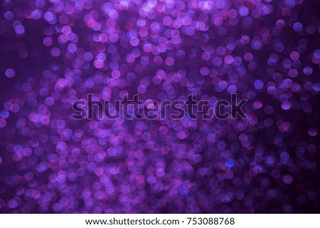 Purple abstract bokeh background with defocused lights christmas