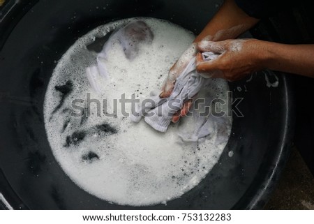 Hand washing white socks  Royalty-Free Stock Photo #753132283