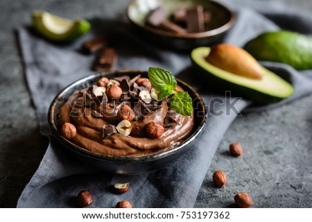 Raw avocado chocolate mousse topped with hazelnuts Royalty-Free Stock Photo #753197362