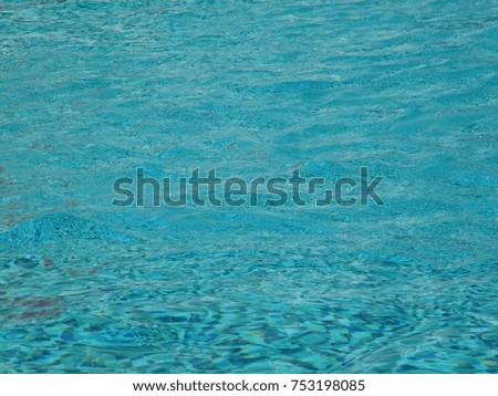 Background of rippled water in swimming pool