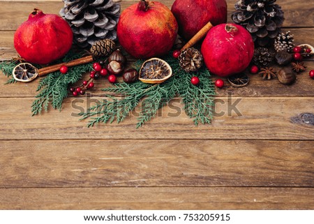 Natural Christmas decorations over wooden background