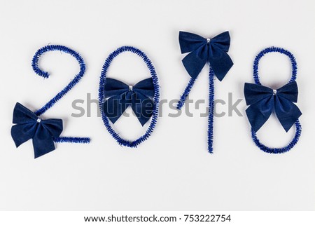 Number 2018 written with Christmas decoration, isolated on white background, Happy New Year