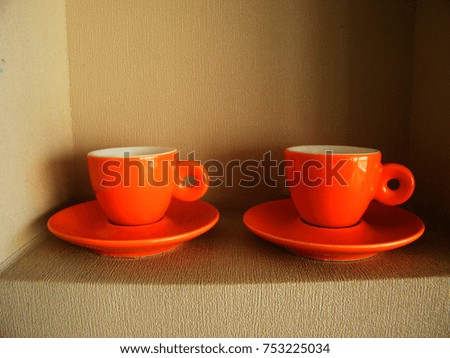 Orange espresso cups and saucers