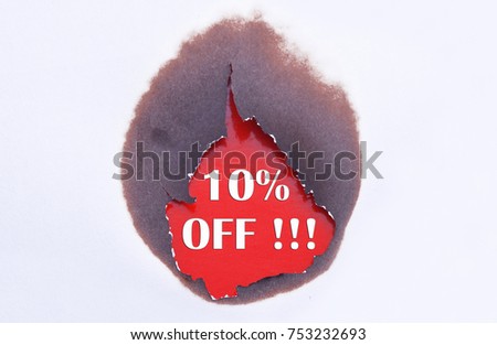 10% off revealed word text appearing behind burned paper