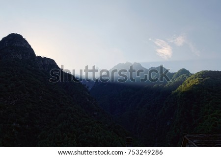 Italian alps, morning light with the sun just behind the mountains of the Val Codera, Valtellina, Italy, Europe