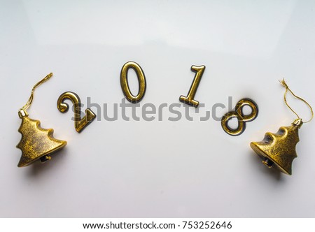 2018 new year background gold Christmas trees toys on white. Top view, close-up. Festive greeting card with copy spase