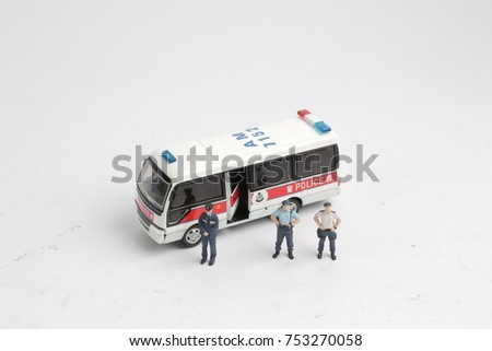 the figure of a police men and police car