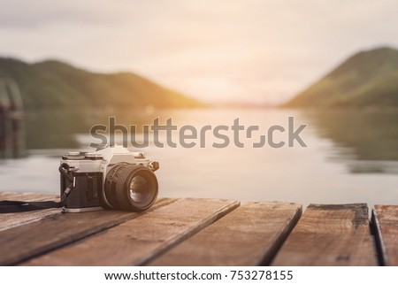 Retro camera with beautiful landscape
