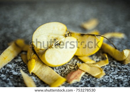 sweet yellow red sliced apple peel acidus fruit on the table raw vegetarian vegan food eating meal