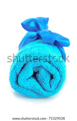Twisted blue towel with band isolated on white