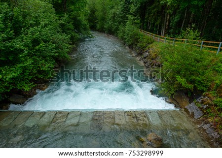 Weir at the river Trettach im Bavaria nearby Oberstdorf