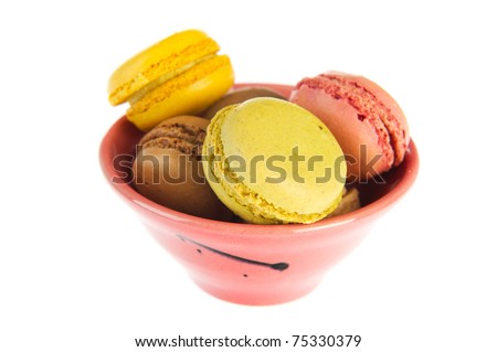 Colorful French macarons isolated over white background