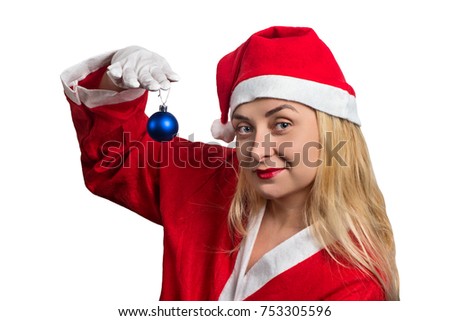 Girl in costume of Santa Claus with Christmas balls in the hands