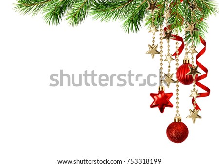 Christmas corner arrangement with green pine twigs hanging red decorations and silk twisted ribbons isolated on white background