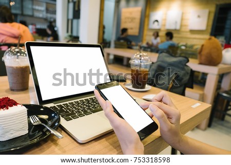 Cropped shot view of man's hands holding smart phone with blank copy space screen for your text message or information content, female reading text message on cell telephone during in urban setting