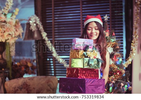 girl with gift box on hand in meeting holiday party.
happy new year and merry Christmas concept.