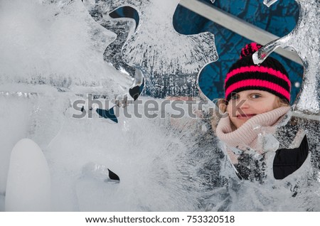 little blond girl with ice sculpture 