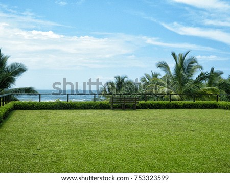 Park bench overlooking sea view in tropical beach Sri Lanka
