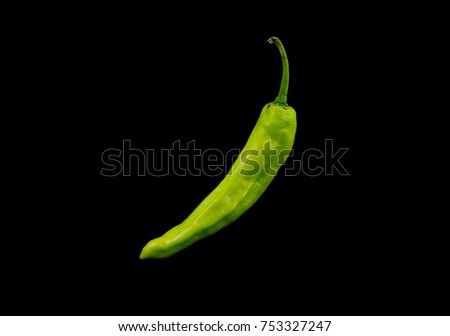 Green chilli isolated on black background Royalty-Free Stock Photo #753327247