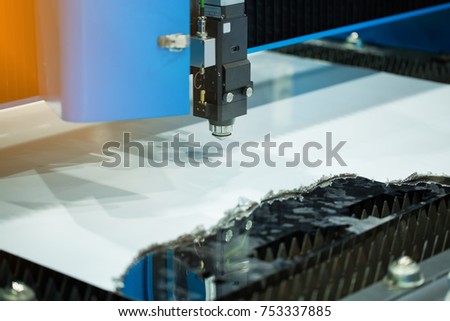 CNC laser cutting metal sheet.Modern industrial technology.