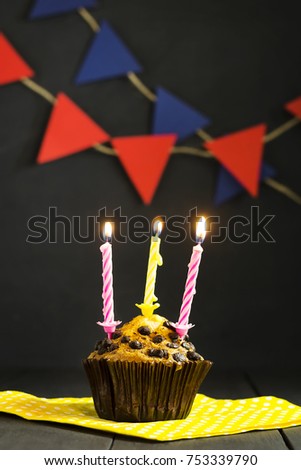 Birthday cupcake on a dark background. Holidays. Happy Birthday. Postcard. Congratulations