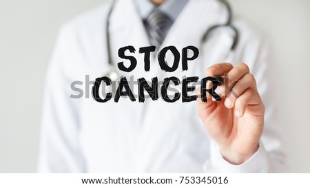 Doctor writing word STOP CANCER with marker, Medical concept