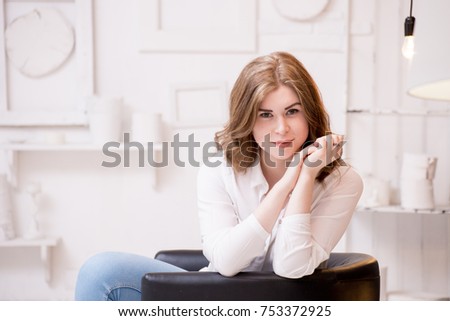 Charming young girl on a studio photo shoot
