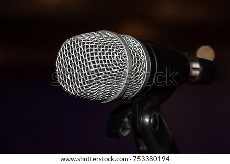 The microphone on a dark background. Selective focus