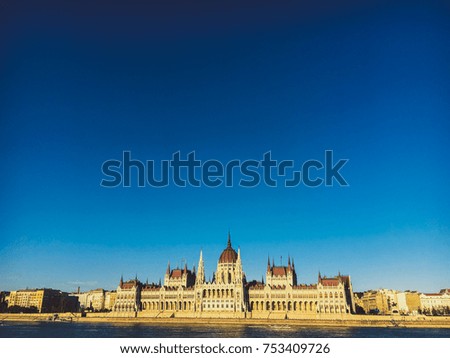 Evening sun on the facade of the Parliament building across Danube river, Budapest, Hungary.