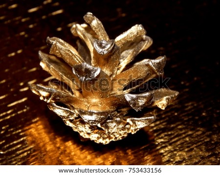 Gold cone on a golden shiny background
