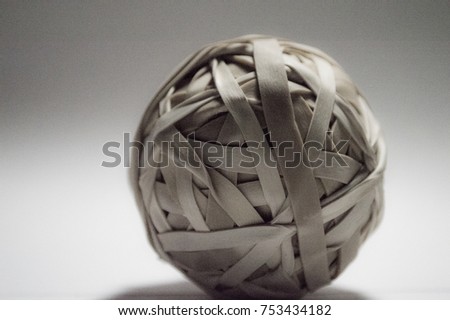 Rubber Band Ball on a gradient background