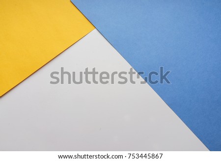 The composition of the colored sheets of paper. Geometric background. Bright typographic design layout, covers, brochures, business cards, banners. Top view, close-up 
