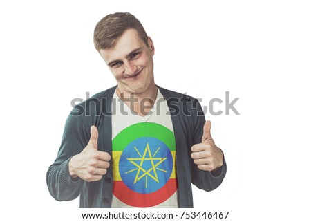 Ethiopia flag on shirt of the funny man showing gesture like a hand on an isolated background.