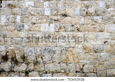 texture of the ancient stone wall of the ancient city