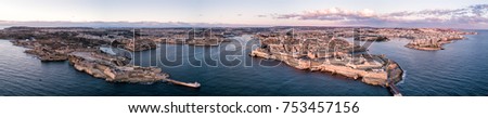 Aerial drone panorama sunrise photo - Ancient capital city of Valletta Malta.  Island Country of Europe in the Mediterranean Sea