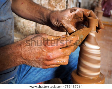 Pottery master works in his atelier in ceramic center of Central Anatolia the town of Avanos, Turkey Royalty-Free Stock Photo #753487264