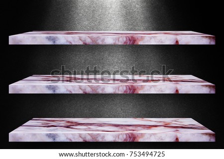 Three empty top of granite marble table on black wall with spotlight backdrop / For product display