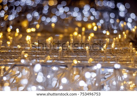 Abstract bright white,yellow and golden Lights blurred bokeh background,blurry lights,glitter sparkle from christmas lights night party with copy space for design content christmas and happy new year