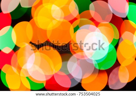Bright blurred festive and colorful Christmas lights abstract background texture. Concept for party, xmas, new year eve, rave, psychedelic, strobes