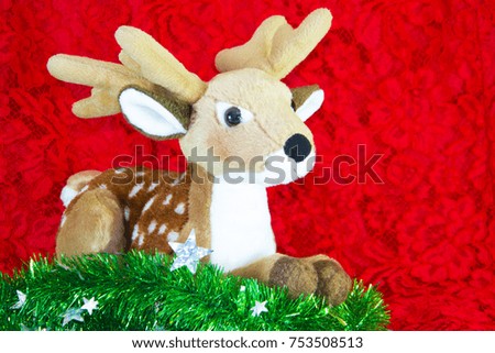 Reindeer and green tree on red background. Merry Christmas and New Year.