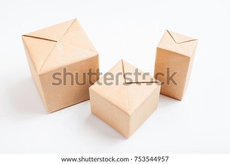 Boxes wrapped in kraft paper. Isolated on white.