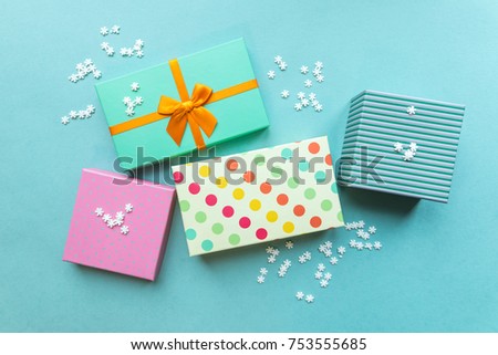 Holidays giftboxes on the pastel  blue background for christmas, birthday party