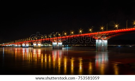 Night landscape, the bridge through the Yenisei River in the downtown Krasnoyarsk, the picture on long endurance