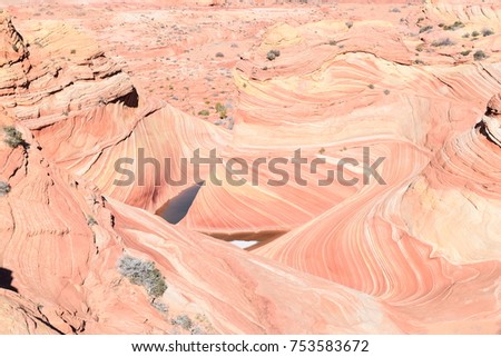 Layered red sandstone at the Wave in the Arizona desert. Royalty-Free Stock Photo #753583672