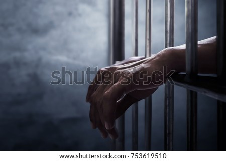 Man in prison Royalty-Free Stock Photo #753619510