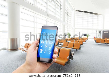 smart phone with smart home and modern airport hall