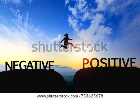 Woman jump through the gap between Negative to Positive on sunset. Royalty-Free Stock Photo #753625678